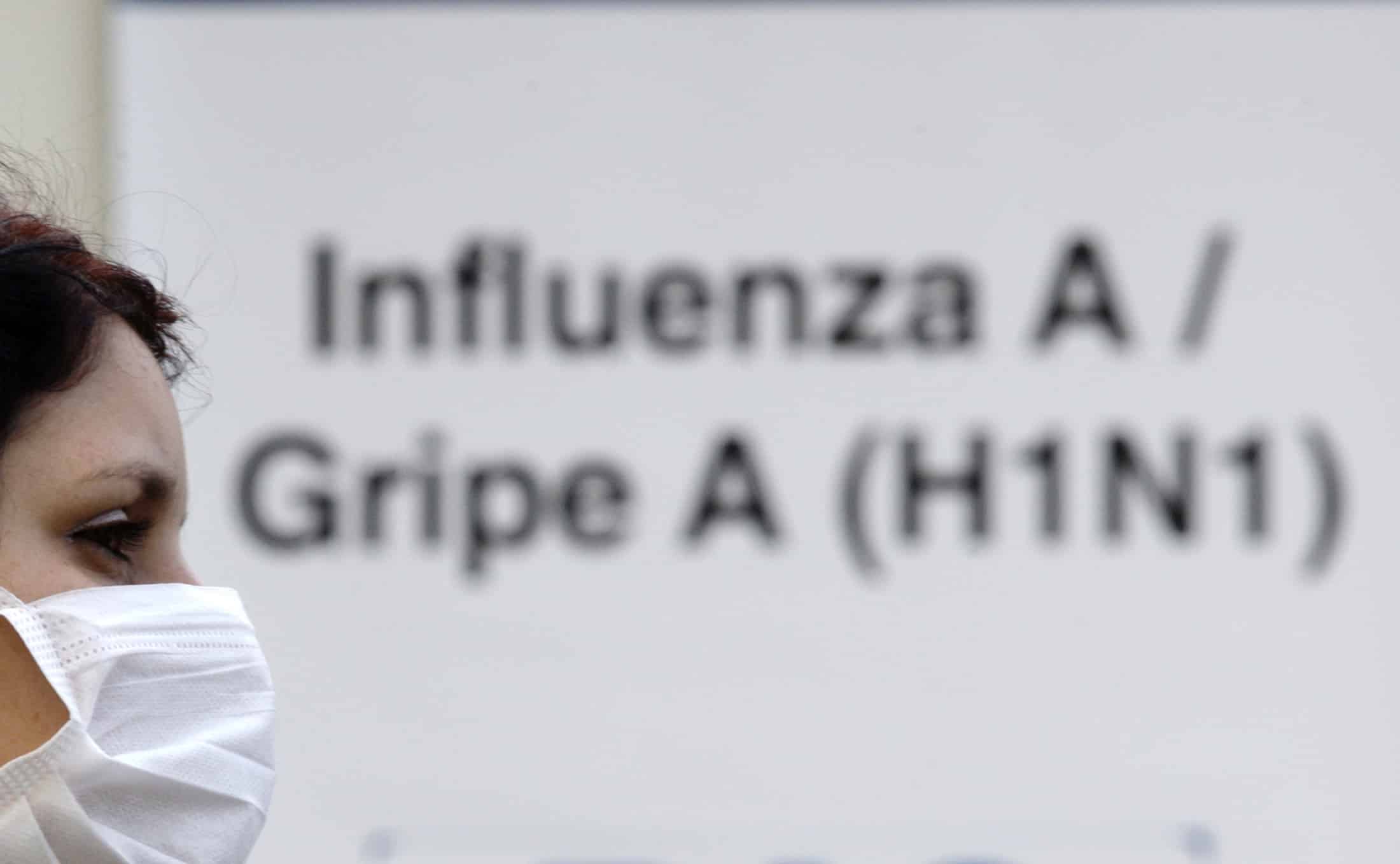 A person with a suspected case of H1N1 influenza virus waits outside Miguel Couto hospital in Rio de Janeiro